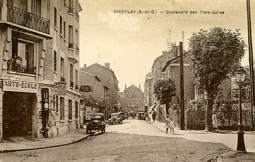 Partie basse du Bd des Trois Gares, au croisement de l’avenue Gaston Boissier. Au premier plan le garage porte les enseignes des principaux constructeurs. (coll. part.)